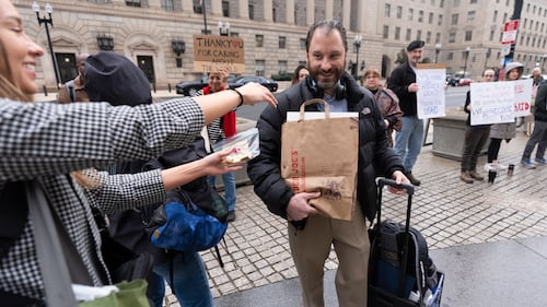 USAID workers pay mournful final visit to agency to clear out their belongings under federal guard